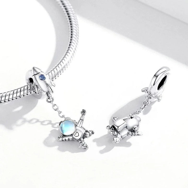 CHARM DE ASTRONAUTA Y PULSERA DE PLATA - GOLD SHIELD