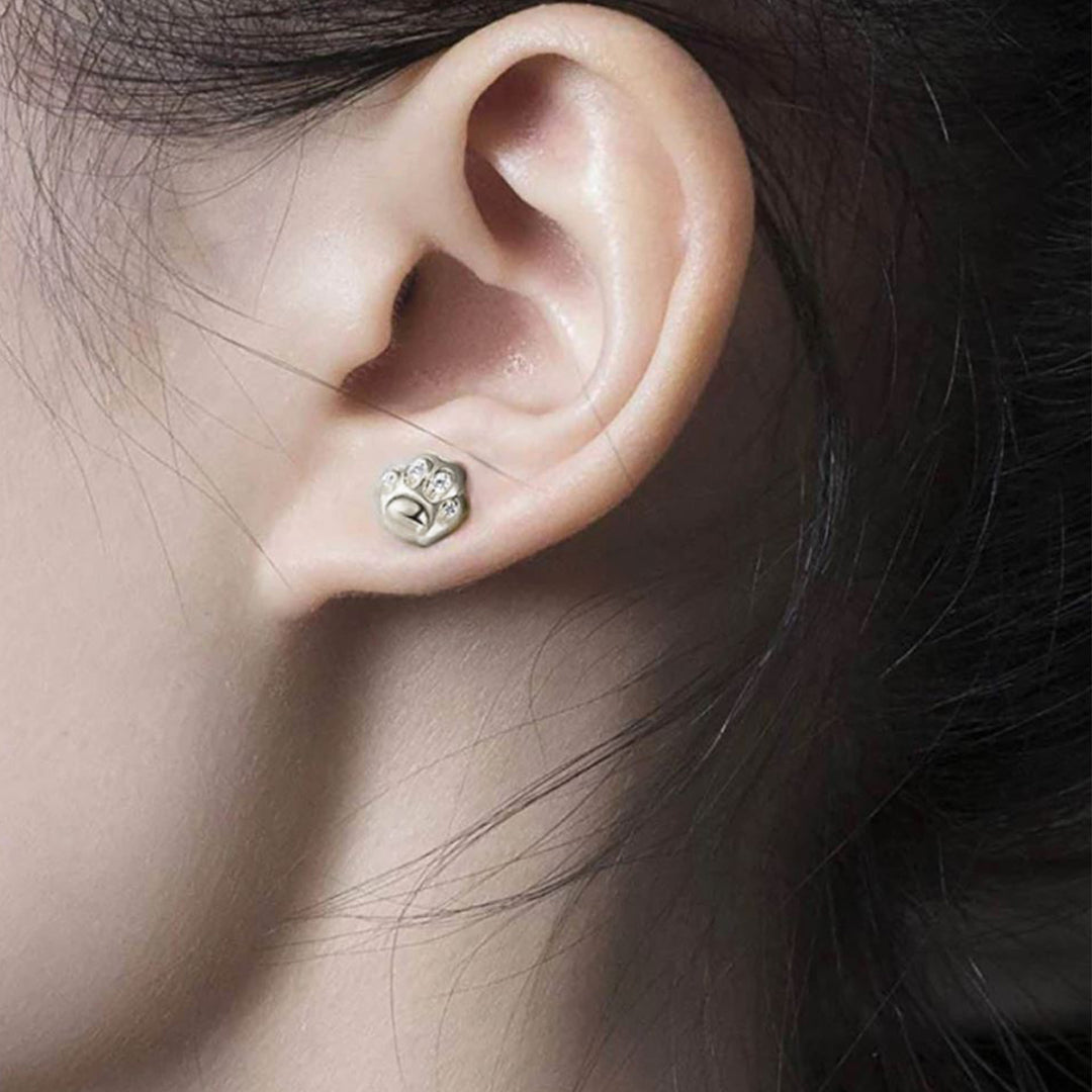 aretes de plata con baño de oro en forma de huella de gato colección cat lovers marca GOLD SHIELD | Joyería de plata