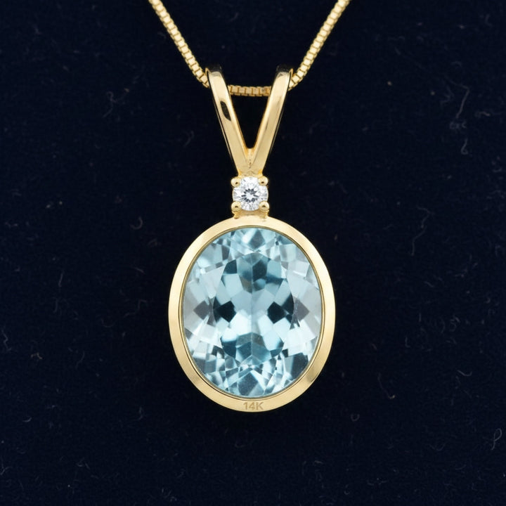 Dije Oro 14k con Topacio Azul Azul cielo 3.21ct, joyería mexicana Gold Shield - PREVENTA