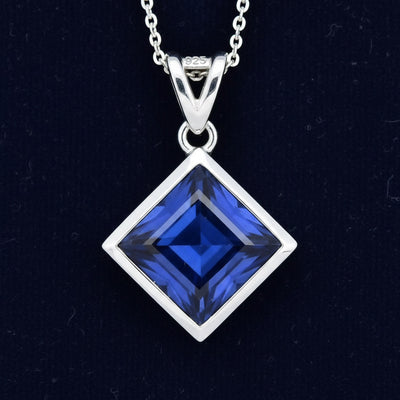 Dije Plata 925 con Zafiro Azul 0.49ct, joyería mexicana Gold Shield - PREVENTA