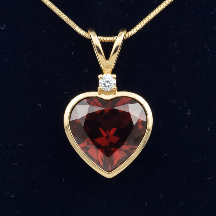 dije oro 14k con granate naranja rojizo natural 3.65ct corte corazon, joyería mexicana Gold Shield