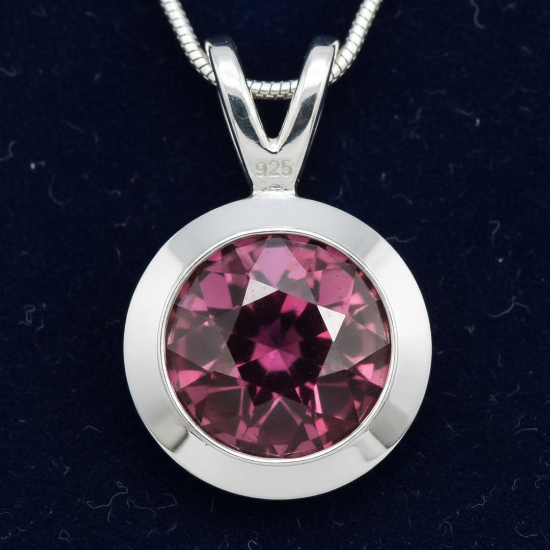 dije de plata 925 con granate rhodolita purpureo rosa natural 1.29ct corte redonda de Africa, joyería mexicana Gold Shield