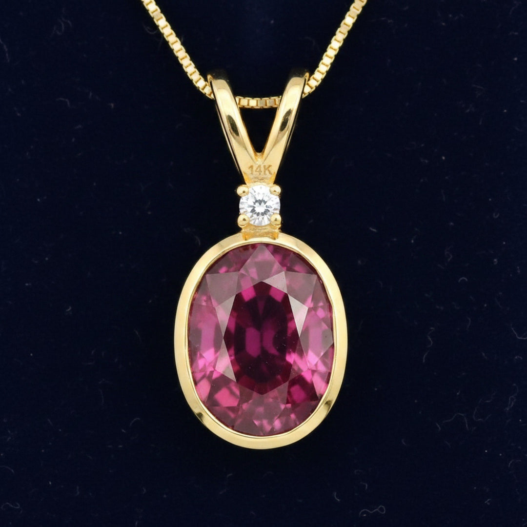 dije de oro 14k con granate rhodolita purpureo rosa natural 2.17ct corte oval de Africa, joyería mexicana Gold Shield