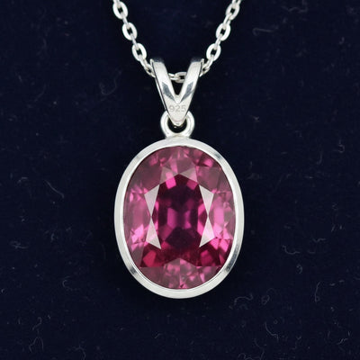 dije de plata 925 con granate rhodolita purpureo rosa natural 2.17ct corte oval de Africa, joyería mexicana Gold Shield