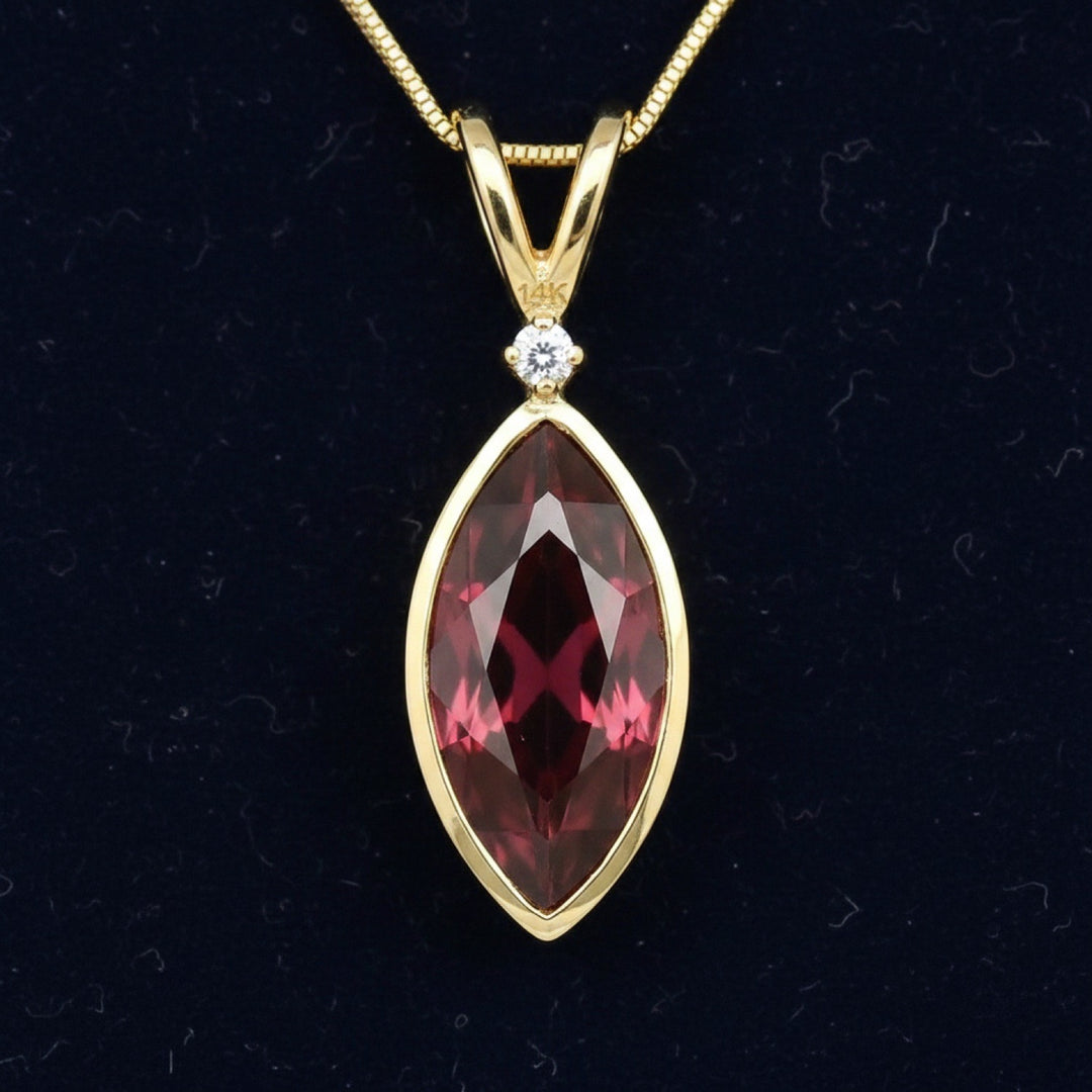 dije de oro 14k con granate rhodolita rojizo rosa natural 5.09ct corte marquesa de Tanzania, joyería mexicana Gold Shield