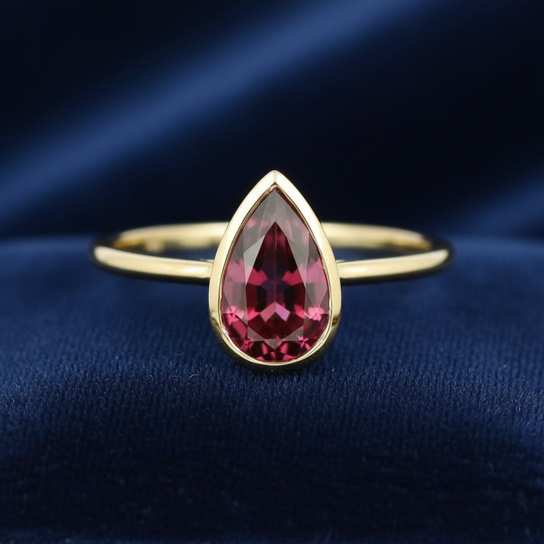 anillo de oro 14k con granate rhodolita rosado rojo natural 3.48ct corte pera de Africa, joyería mexicana Gold Shield