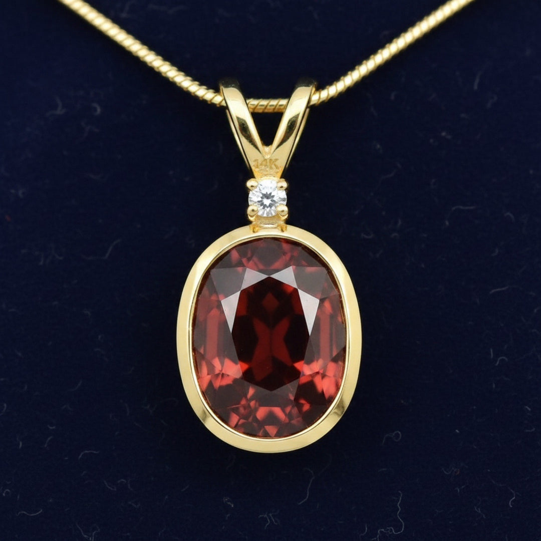 dije oro 14k con granate rojizo naranja natural 3.85ct corte oval, joyería mexicana Gold Shield