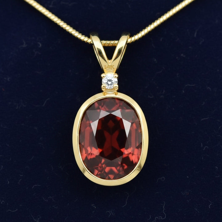 dije oro 14k con granate rojizo naranja natural 3.85ct corte oval, joyería mexicana Gold Shield