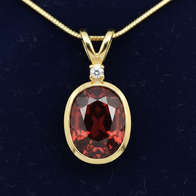 dije oro 14k con granate rojizo naranja natural 3.85ct corte oval, joyería mexicana Gold Shield