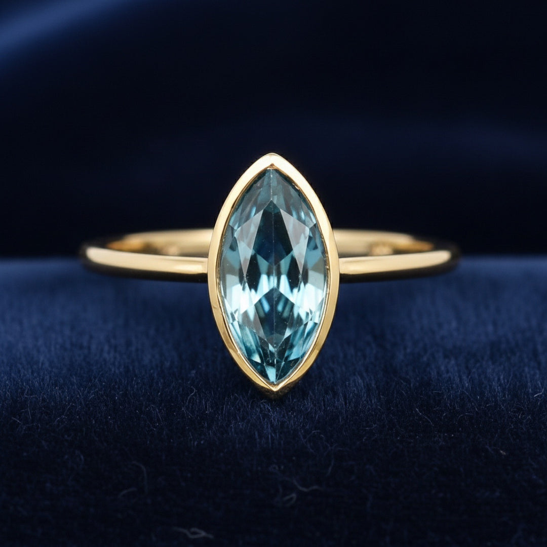 anillo de oro 14k con topacio london blue natural 0.89ct corte marquesa de Brasil, joyería mexicana Gold Shield