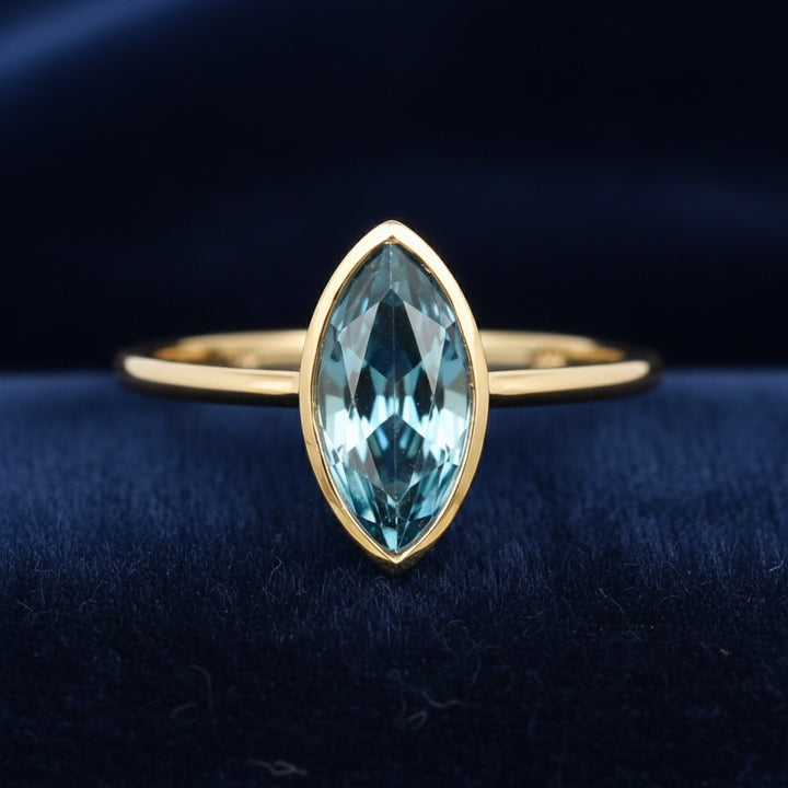 anillo de oro 14k con topacio london blue natural 0.89ct corte marquesa de Brasil, joyería mexicana Gold Shield
