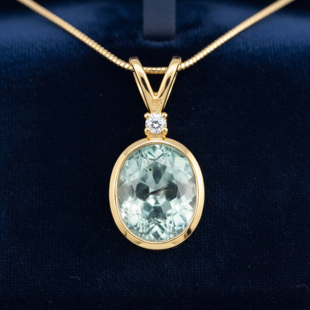 dije de oro 14k con turmalina azulado verde natural 1.74ct corte oval de Africa, joyería mexicana Gold Shield