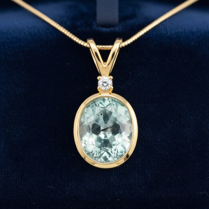dije de oro 14k con turmalina azulado verde natural 1.74ct corte oval de Africa, joyería mexicana Gold Shield