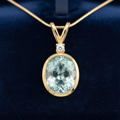 dije de oro 14k con turmalina azulado verde natural 1.74ct corte oval de Africa, joyería mexicana Gold Shield