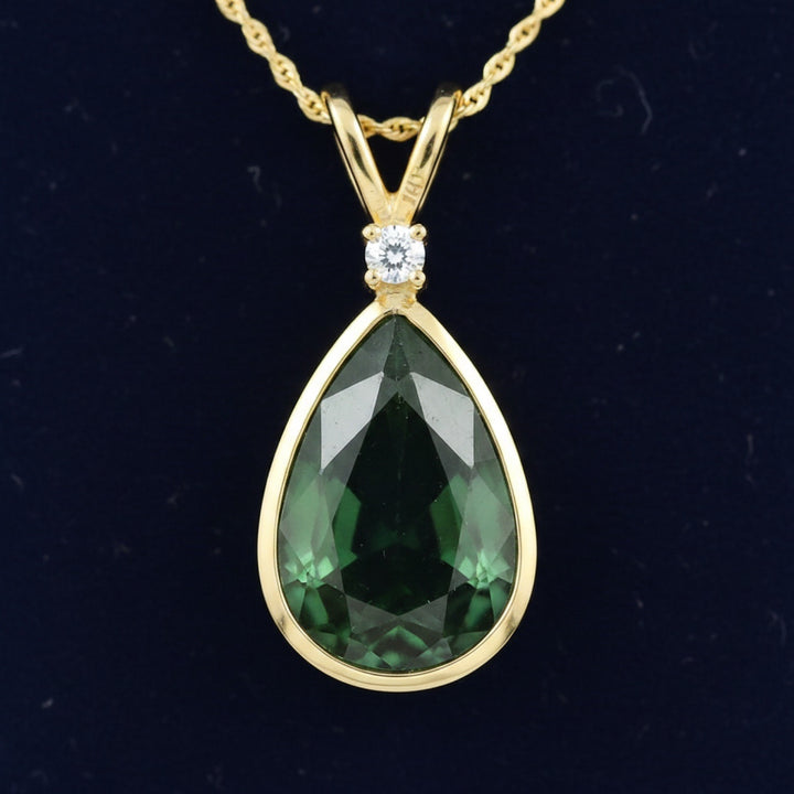 dije oro 14k con zafiro verde natural 0.89ct corte pera, joyería mexicana Gold Shield