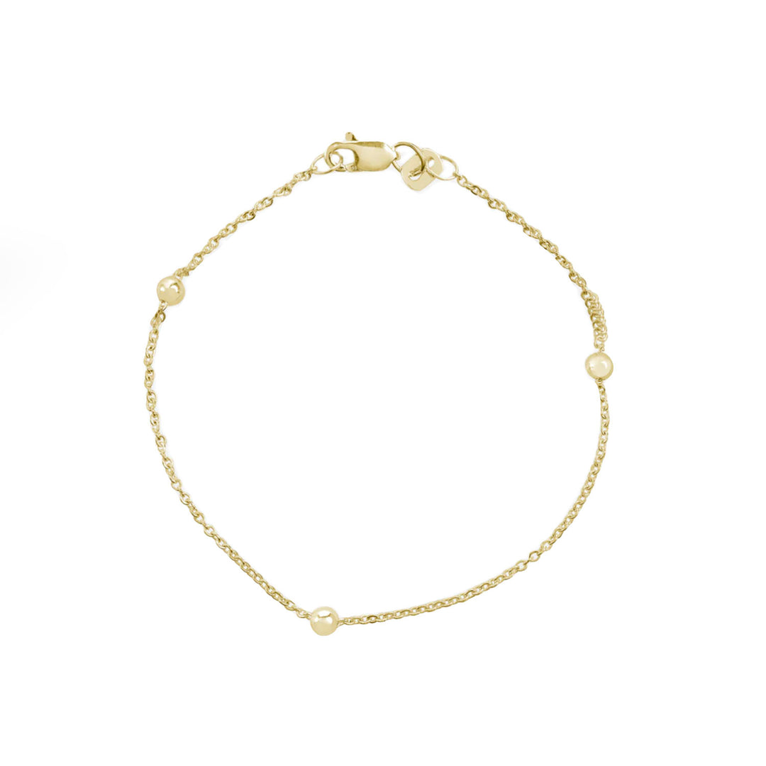 Pulsera de oro bolitas fondo blanco - GOLD SHIELD