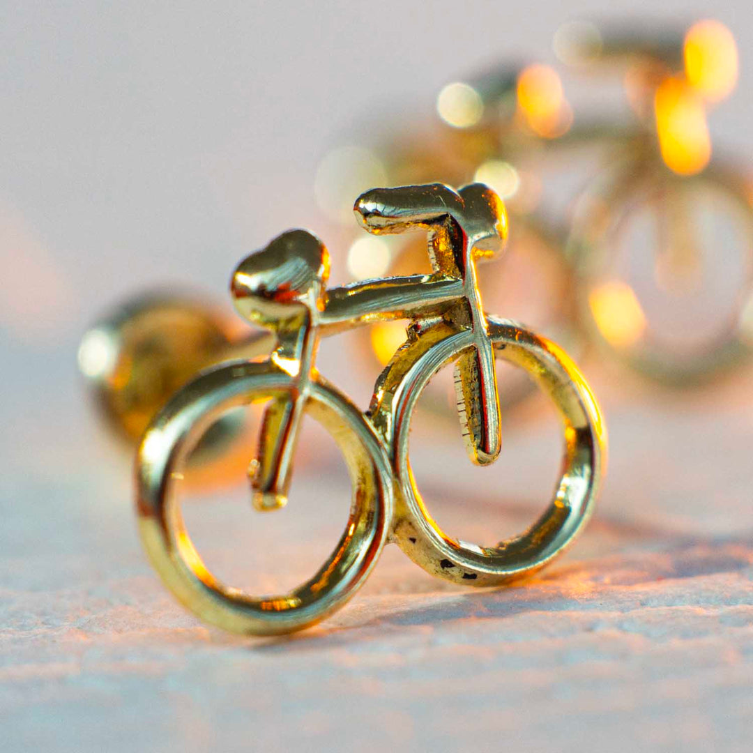 Aretes de oro para niña en forma de bicicleta 